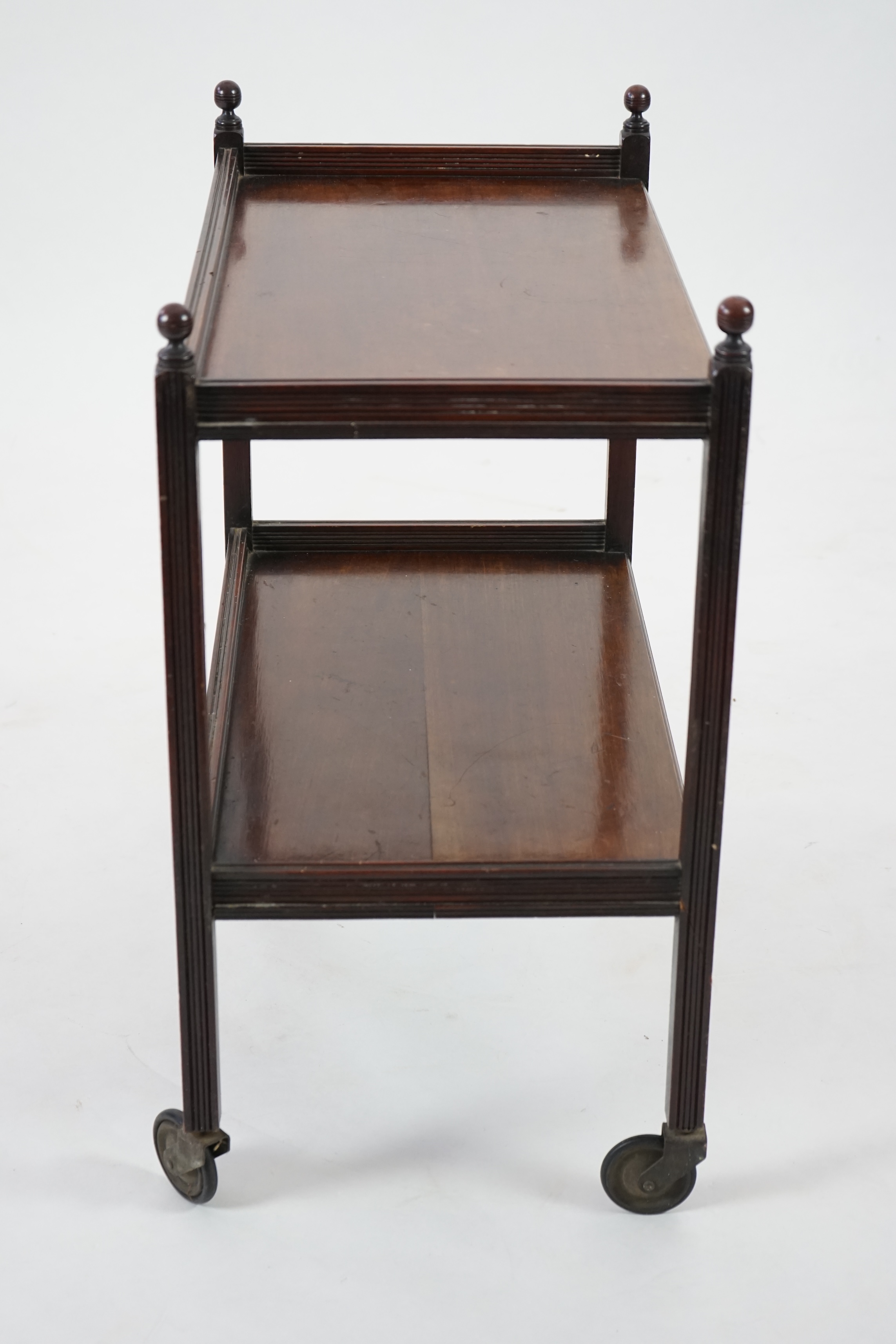 An Edwardian mahogany two tier trolley